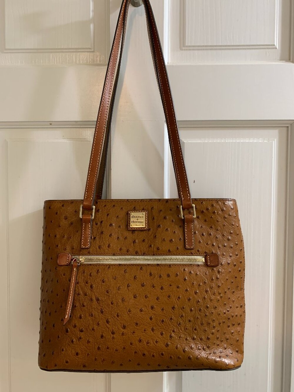 Dooney and Bourke embossed leather handbag in cognac